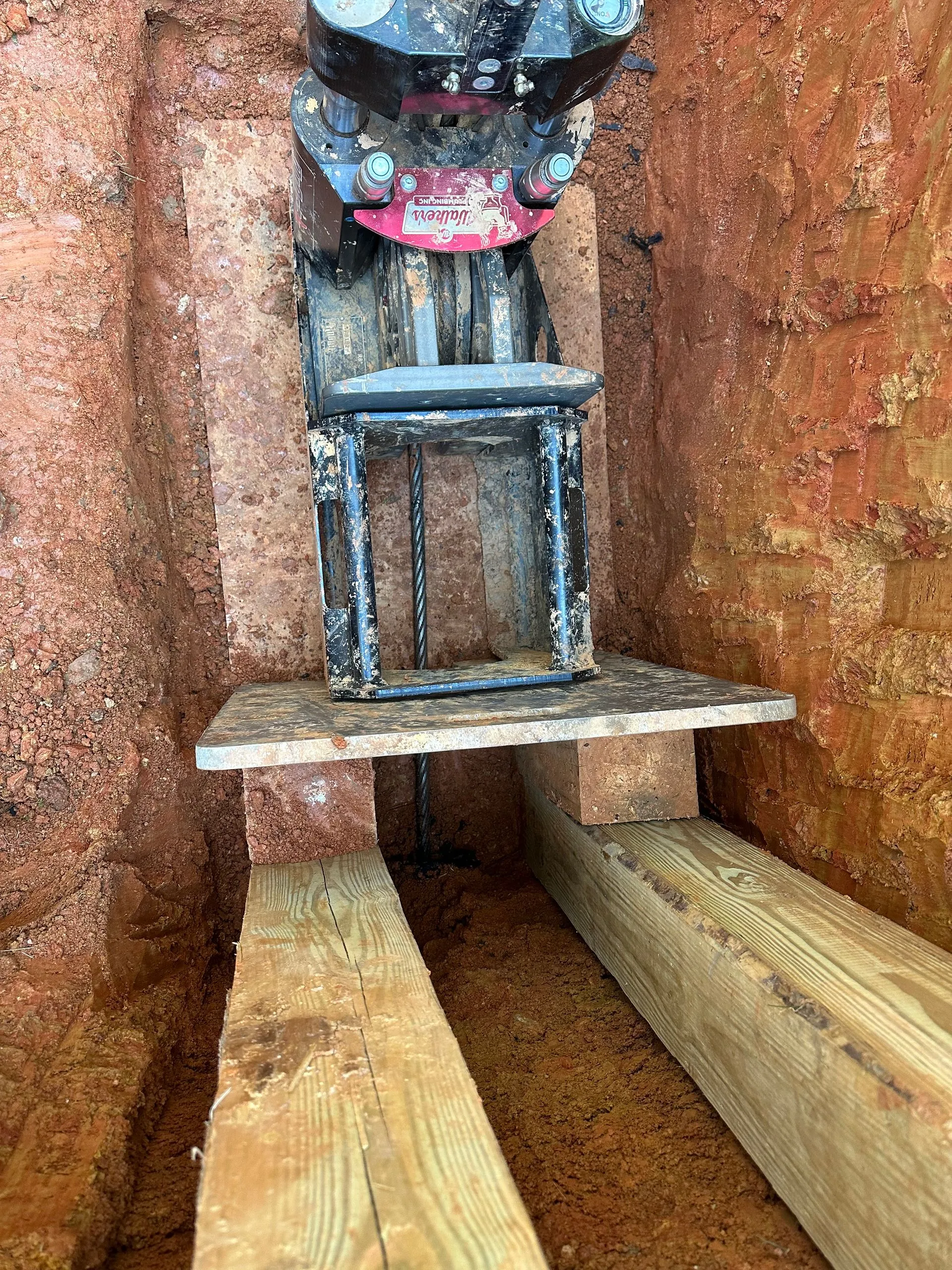 Technician performing well pump replacement at rural Lynchburg property